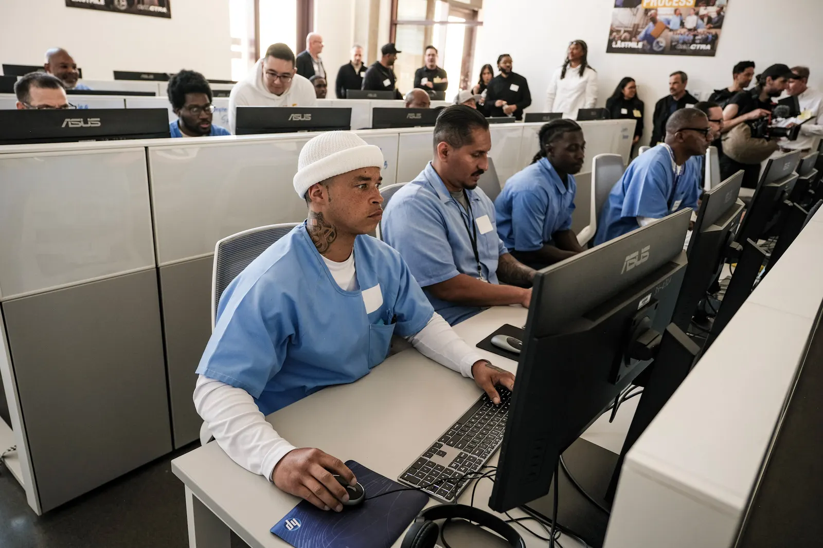 Students at computers in a Last Mile classroom inside a correctional facility